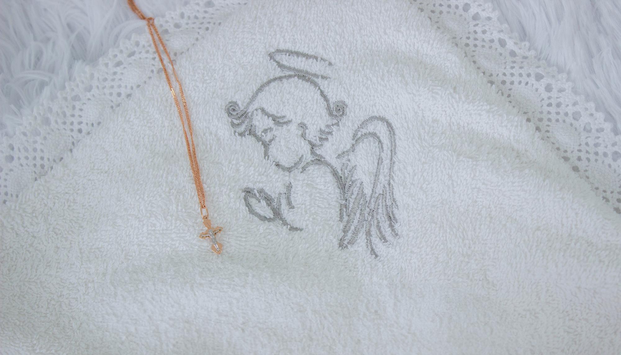 Hand stitching initials on linen