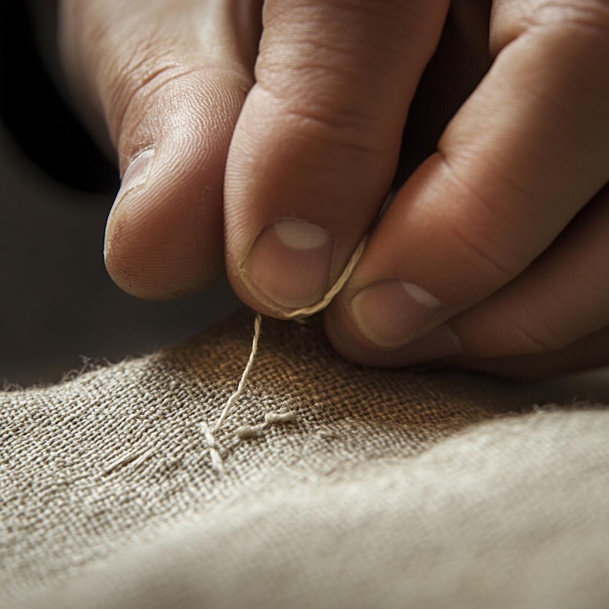 Close-up of hand embroidery on linen
